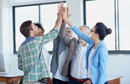 Business, people and high five in office for teamwork, celebration group and employees together Success, hand gesture and professional collaboration for achievement, meeting and target goalの写真素材