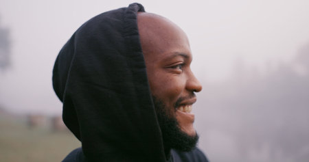 Black man, thinking and rain for travel outdoor on camping adventure, explore and nature journey in...