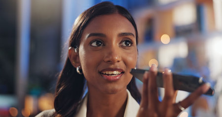 Woman, phone call and talking on loudspeaker for communication, networking and voice chat in home....