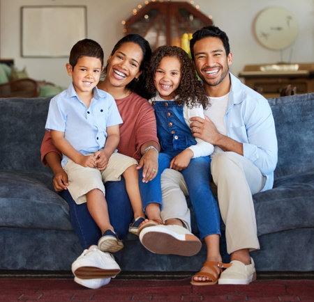 Portrait, family and parents with children on sofa for relax, comfortable or bonding together in...