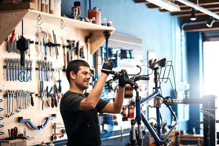 Bike repair, maintenance and smile with man in workshop for frame building or professional...