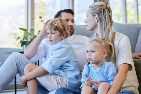 Concern, worry and family watching tv together in living room of home for entertainment supervision....