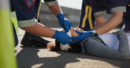 Paramedic, emergency and hands on head injury on road in car crash accident with healthcare help....