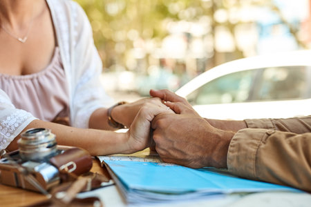 Couple, holding hands and travel with map and explore, people and route for road trip photography. Adventure, holiday and Australia city for man, woman and sightseeing vacation for honeymoon journeyの写真素材