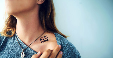 Tattoo, words or person with design on body or shoulder for unique creative style in studio on blue...