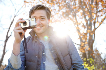 Man, camera and portrait for photography outdoor with adventure travel, explore nature and...
