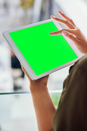 Hands, employee and green screen on tablet in office for mockup space for research and networking....