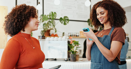 Woman, smartphone and nfc with waiter in coffee shop to pay for sale, ecommerce and digital checkout. Customer, happy and technology for internet banking, payment and online transaction in cafe.の写真素材