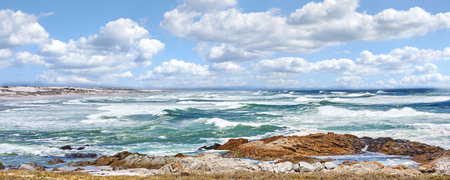 Beach, sea and waves landscape with sky and horizon for peace, travel destination and holiday location. Banner, evening and ocean water for tropical environment, skyline and scenery in natureの写真素材