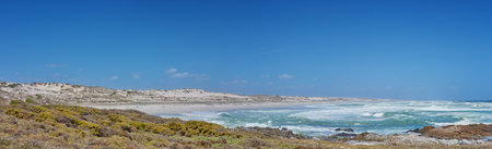 Ocean, island and horizon in outdoor nature, travel and peace in environment on sea vacation. Water, location and calm beach on weekend trip, tropical paradise and holiday wallpaper of Bali skylineの写真素材