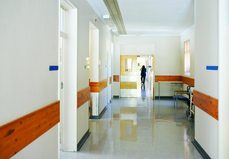 Corridor, interior and healthcare with ward in hospital for emergency, medical or wellness. Background, hallway and medicine with empty clinic for appointment, checkup or recovery from surgeryの写真素材