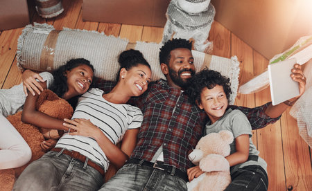 Carpet, family and selfie on floor in new home to capture memory of growth or real estate investment. Love, milestone or property with mom, dad and children in living room of apartment from aboveの写真素材