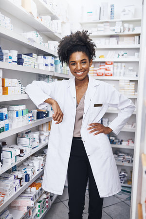 Woman, pharmacist and happy portrait in drugstore, healthcare and medication advisor in pharmacy....