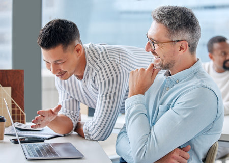 Teamwork, smile and laptop in planning with people for help, advice and opinion on report at table. Mentorship, support and feedback or proposal for project, collaboration and idea for discussionの写真素材