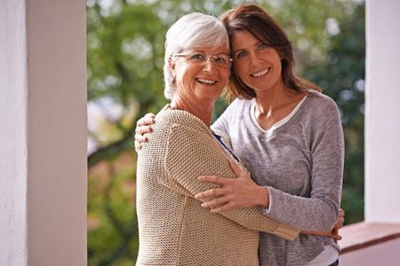 Portrait, senior and mom hug daughter with love, outdoor and patio of home, smile and happiness....
