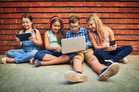 Entertainment, kids and technology at wall for movie, fun and music in city. Tablet, laptop or...