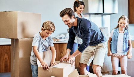 Family, moving and kids with cardboard in new house for real estate, unpacking or property...