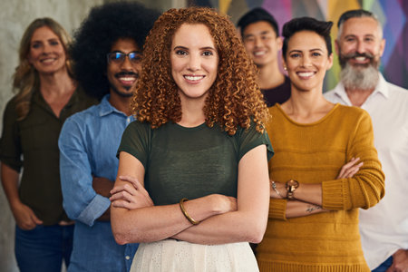 Creative, employees and smile of leader, portrait and people of sales in company and networking. Happy, teamwork and executive in deal, proposal or office of startup, face or writer in businessの写真素材
