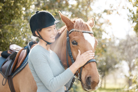 Woman, horse and smile in farm for ride with care, love and hobby in California. Female person, countryside and happy in forest for adventure, fun and relax or bonding on break for activity as riderの写真素材