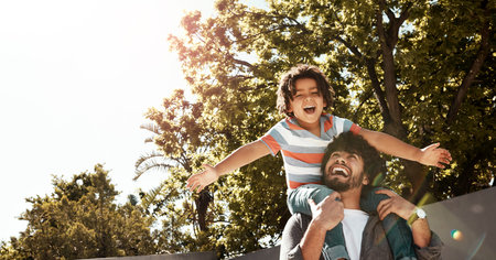 Happy dad, child and bonding with piggyback at backyard for love, freedom or holiday together at...
