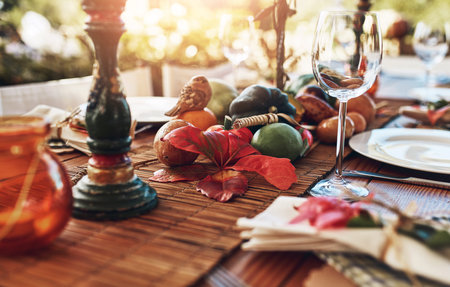 Thanksgiving, holiday and preparation for feast, table and closeup to decoration, food and creative. Restaurant, glass and catering for event, celebration and dinner buffet, outdoor and vegetableの写真素材