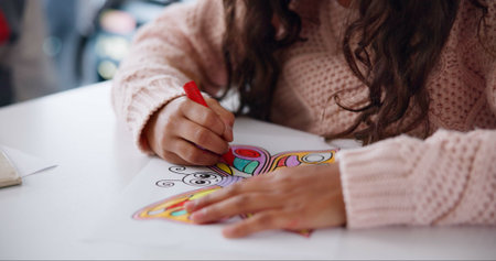 Color, crayon and hands of child in classroom, growth and development of student in school and...