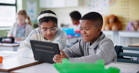 Friends, studying and children with tablet in classroom, clever and helping with classwork and...