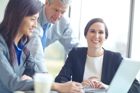 Portrait, woman and attorney with laptop at office in communication, networking and connection. Business people, tech and discussion in law firm, company and legal consultant in group for researchの写真素材