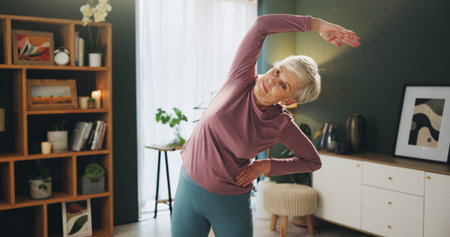 Senior woman, stretching and workout with fitness for exercise, balance or physiotherapy at home....
