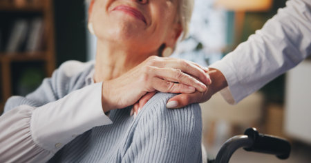 Senior woman, hands and wheelchair with nurse in care for support, trust or love for patient at...