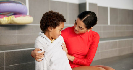 Mom, boy and comfort on swimming lesson at training center for fitness, childcare and child...