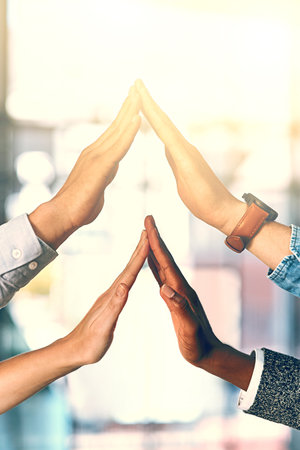 Teamwork, touch and hands of business people in office for collaboration, connection and support in company. Corporate, diversity and fingers of workers for agreement, cooperation and partnershipの写真素材