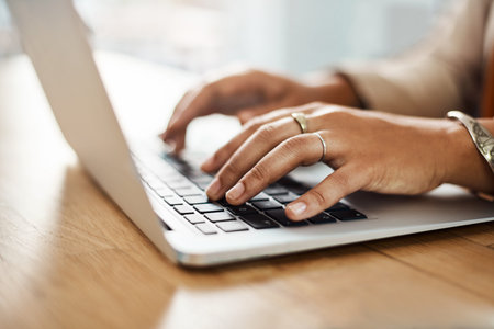 Desk, laptop and hands of person for research, business article and news typing for publication in...