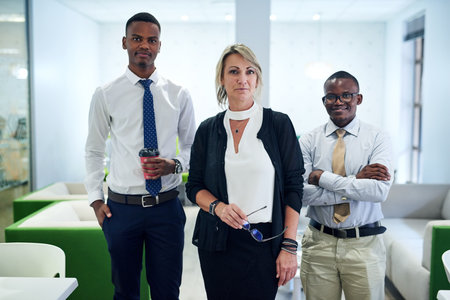 Confident, employees and about us with leader at office for teamwork, collaboration and portrait. People, business and diversity with boss or team manager for career growth and job opportunityの写真素材