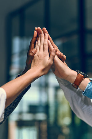 Celebration, business people and hands in office for high five, team and success for creative agency. Unity, employees or designers in collaboration for achievement, support and cheers for well doneの写真素材