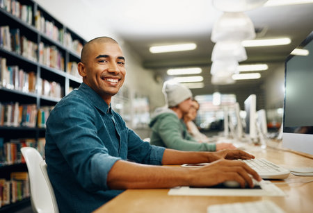 Student, computer and study in college library for programming test, project and online exam. Black...