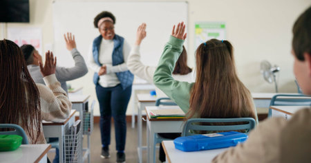 Hands, question and students in classroom, education and preparing for exam with teacher, learning...