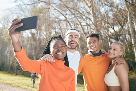 Fitness, selfie and people in park for training, exercise and running workout in nature. Sports, friends and men and women for wellness, health and cardio outdoors for teamwork, photo and supportの写真素材