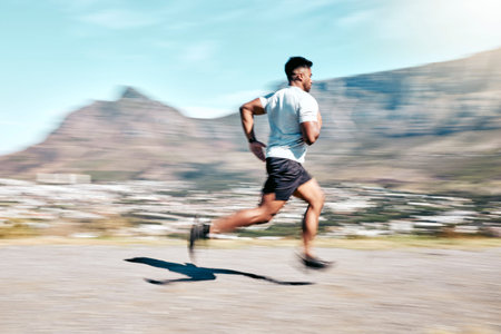 Outdoor, man and running for fitness on road with exercise, training and workout in Brazil. Male...
