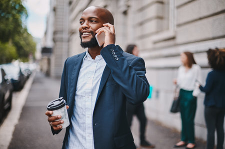 City, thinking and business man in phone call with client, conversation and planning for meeting. Outdoor, black person or corporate employee with mobile for communication, listening and contactの写真素材