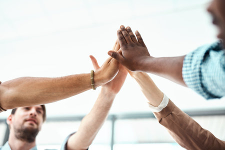Business people, hands and high five for celebration, partnership or collaboration with teamwork or agreement. Group, creative employees and workers for team support, success and diversity in agencyの写真素材