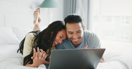 Bedroom, home and couple with laptop, hug and conversation with love, romance and dating. Apartment,...