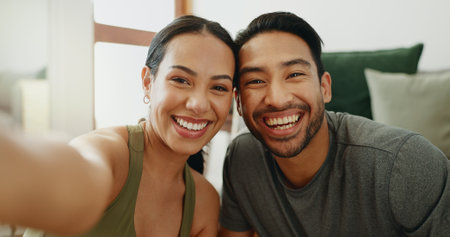 Selfie, happy and portrait of couple on sofa for bonding, relationship and relax together in home. Dating, new house and man and woman take photo for profile picture, social media and online postの写真素材