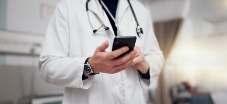 Hands, doctor and man with smartphone, typing and healthcare with online schedule, internet and...