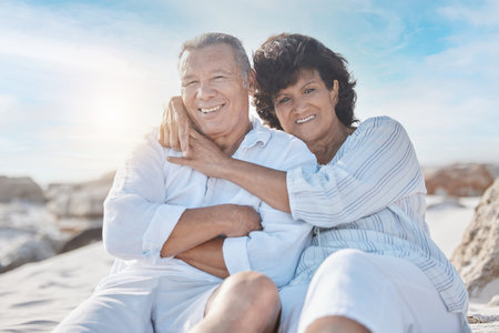 Hug, beach and portrait of senior couple on summer vacation, getaway or holiday for travel. Smile, love and mature man and woman embracing by seaside on tropical weekend trip for anniversary date.の写真素材
