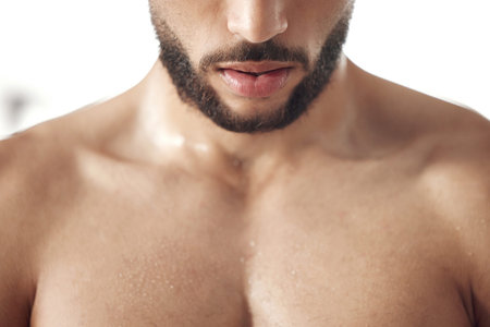 Man, lips and beard closeup with face for beauty, grooming or personal hygiene. Facial, cosmetics or skin of strong bodybuilder with sweat on pectoral muscle for power, growth and wellness for healthの写真素材