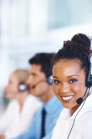 Business people, telemarketing and woman with call center, portrait or communication with headset. Group, employees or insurance agent with headphones, help desk or customer service with tech supportの写真素材