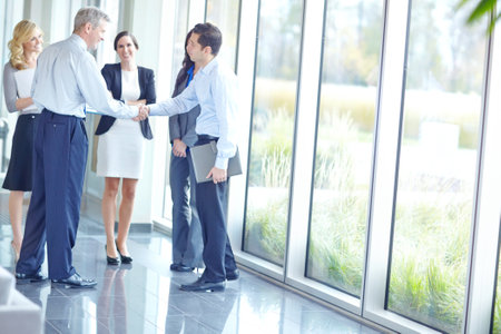 Business, people and handshake for welcome at office with congratulations on corporate deal and opportunity. Meeting, thank you and happy for partnership, support and agreement on collaborationの写真素材