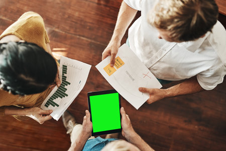 Business, people and above with green screen on tablet in meeting for sales planning, kpi or...