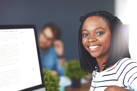 Portrait, African woman and career with computer screen as copywriter for digital design agency....